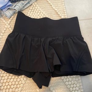 Black Lululemon running shorts with spandex under